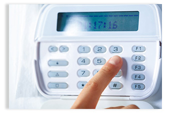 woman dialing for alarm security systems
